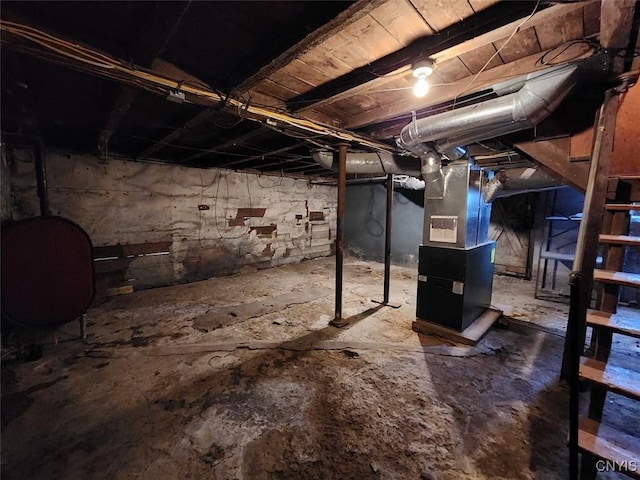 unfinished below grade area featuring heating fuel and heating unit