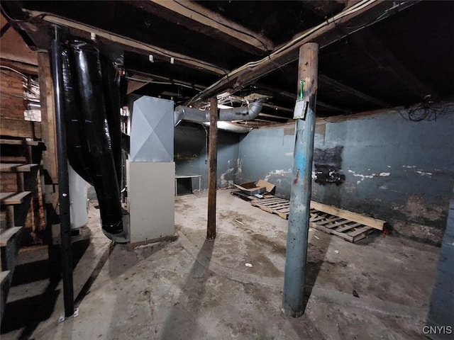 unfinished basement with gas water heater