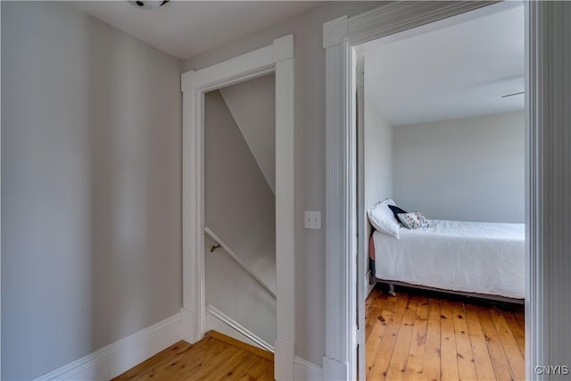 11853 State Route 12e, Lyme, NY 13622 - hall with wood-type flooring, an upstairs landing, and baseboards