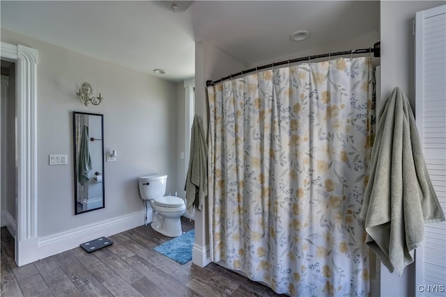 11853 State Route 12e, Lyme, NY 13622 - full bath with toilet, wood finished floors, a shower with curtain, and baseboards