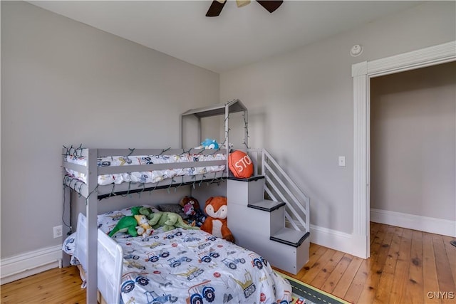 11853 State Route 12e, Lyme, NY 13622 - bedroom featuring baseboards, a ceiling fan, and hardwood / wood-style floors
