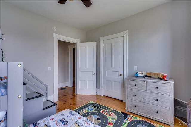 11853 State Route 12e, Lyme, NY 13622 - bedroom with light wood-style flooring, baseboards, and ceiling fan