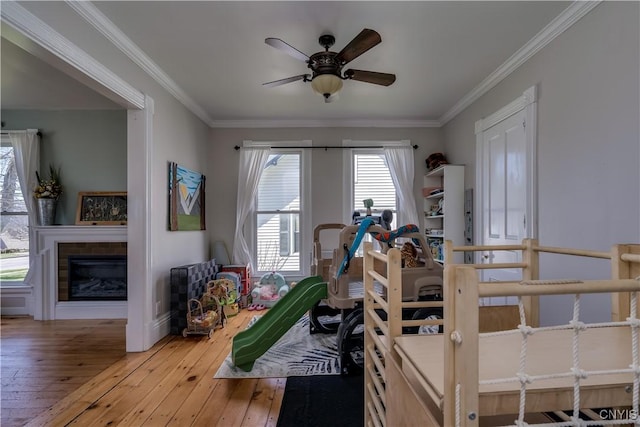 11853 State Route 12e, Lyme, NY 13622 - interior space featuring hardwood / wood-style floors, ceiling fan, and crown molding