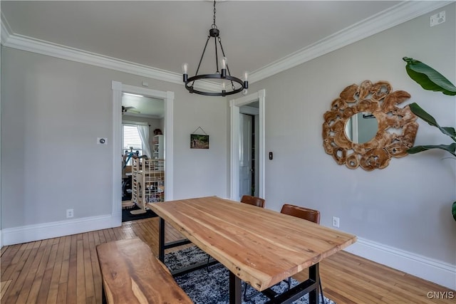 11853 State Route 12e, Lyme, NY 13622 - dining room with crown molding, light wood-style flooring, a notable chandelier, and baseboards