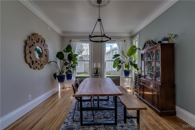 11853 State Route 12e, Lyme, NY 13622 - dining space with a chandelier, baseboards, and ornamental molding