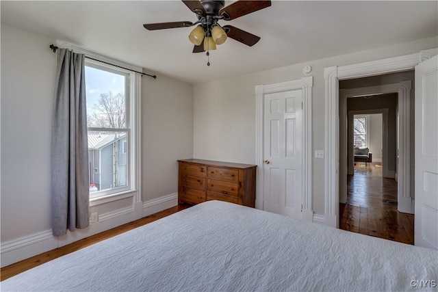 11853 State Route 12e, Lyme, NY 13622 - bedroom featuring baseboards, ceiling fan, and wood finished floors
