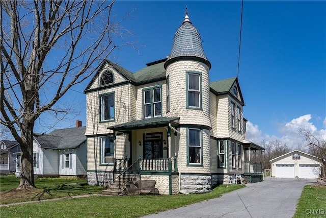 11853 State Route 12e, Lyme, NY 13622 - victorian-style house with an outbuilding and a garage