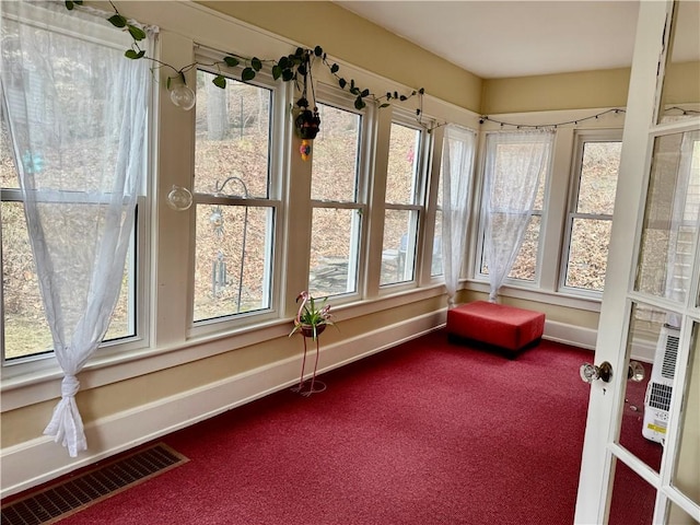 11 Cedar St, Oneonta-City, NY 13820 - unfurnished sunroom featuring carpet, visible vents, baseboards, and a healthy amount of sunlight