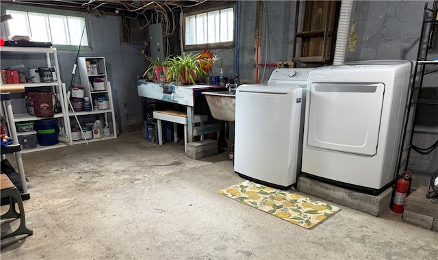 11 Cedar St, Oneonta-City, NY 13820 - basement with electric panel, separate washer and dryer, and a sink