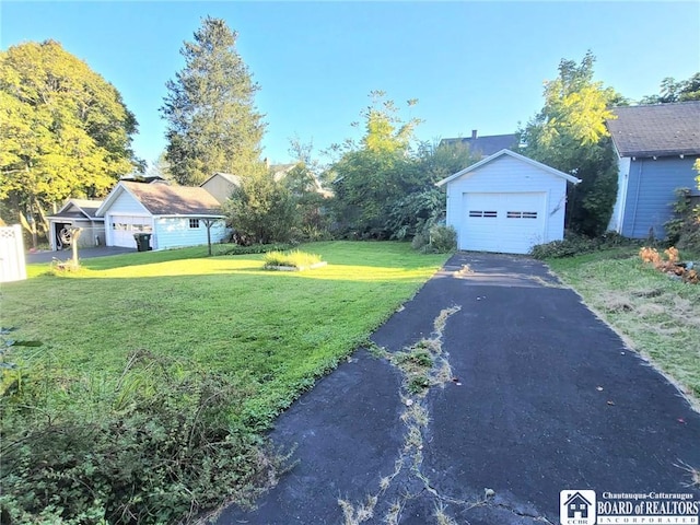 85 Dearborn St, Jamestown, NY 14701 - view of yard with aphalt driveway, an outdoor structure, and a detached garage