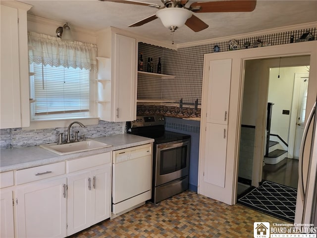 85 Dearborn St, Jamestown, NY 14701 - kitchen with white dishwasher, stainless steel range with electric stovetop, a sink, ceiling fan, and white cabinetry