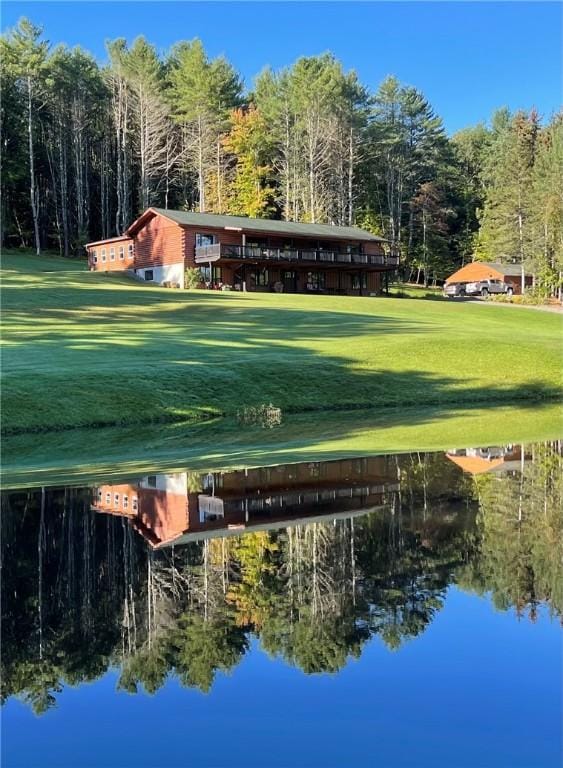 438 Ymca Rd, Laurens, NY 13861 - view of property's community featuring a water view, a view of trees, and a lawn