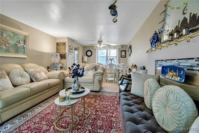 4757 N Bailey Ave, Amherst, NY 14226 - carpeted living room with a ceiling fan and a tile fireplace
