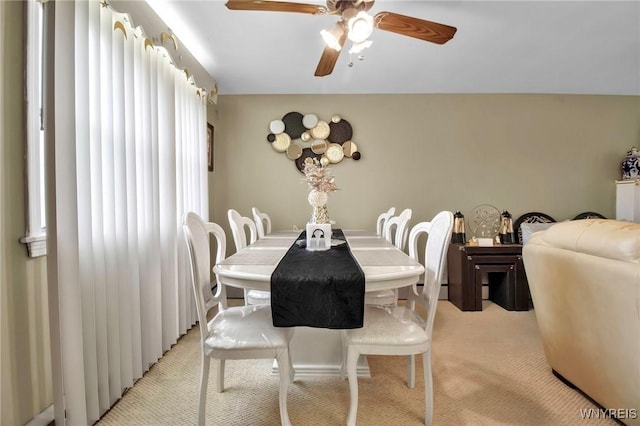 4757 N Bailey Ave, Amherst, NY 14226 - dining space with light colored carpet and a ceiling fan