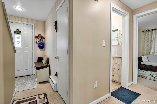 4757 N Bailey Ave, Amherst, NY 14226 - hallway featuring light carpet, baseboard heating, and baseboards