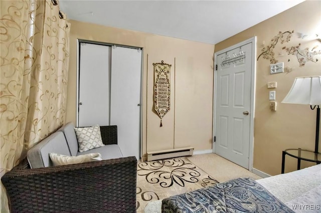 4757 N Bailey Ave, Amherst, NY 14226 - bedroom with a baseboard radiator, a closet, light colored carpet, and baseboards