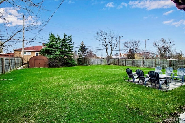 4757 N Bailey Ave, Amherst, NY 14226 - view of yard with a shed, a patio area, a fenced backyard, and an outbuilding
