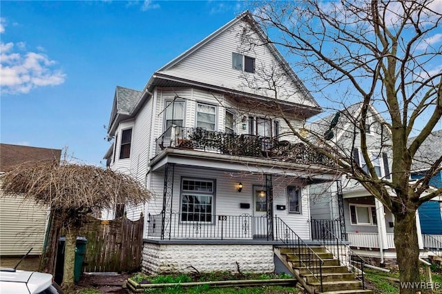 10 Abbottsford Pl, Buffalo, NY 14213 - view of front of house with covered porch, fence, and a balcony