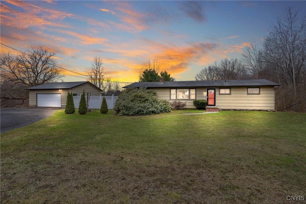 9329 Oswego Rd, Lysander, NY 13135 - ranch-style house with a chimney, aphalt driveway, entry steps, fence, and a lawn