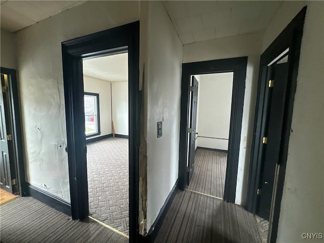 hallway featuring baseboards
