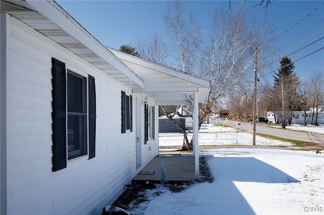 view of yard layered in snow