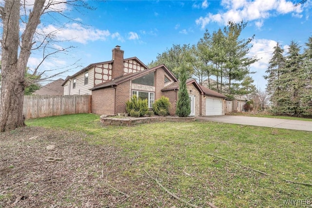 view of front of home with a front yard, fence, brick siding, a chimney, and driveway
