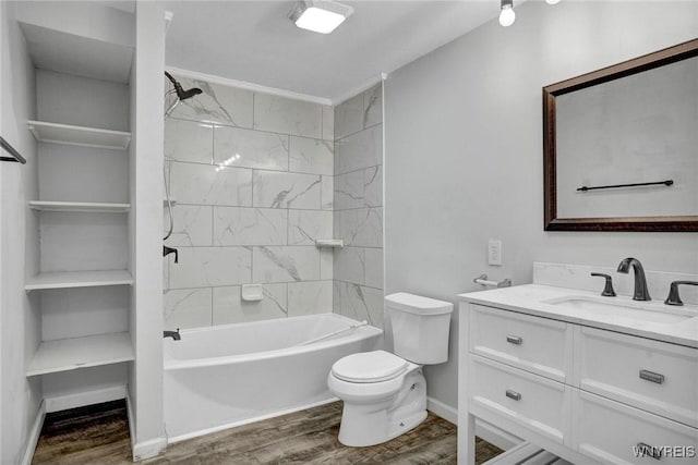 bathroom featuring vanity, shower / tub combination, toilet, and wood finished floors