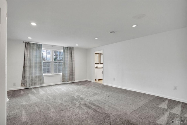 carpeted empty room with recessed lighting and baseboards