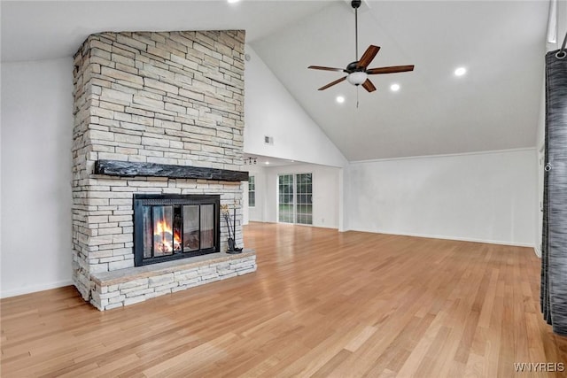 unfurnished living room featuring a fireplace, baseboards, a ceiling fan, and wood finished floors