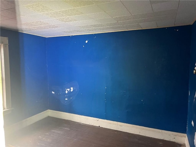 empty room featuring baseboards