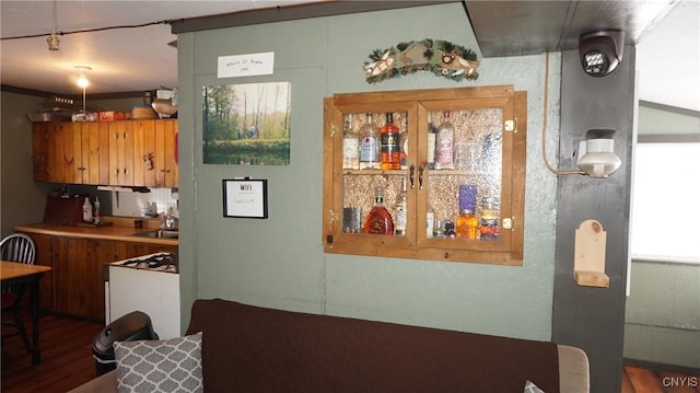 50 Apache Springs Rd, Boylston, NY 13083 - kitchen featuring wood finished floors, a sink, and brown cabinetry
