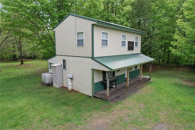 50 Apache Springs Rd, Boylston, NY 13083 - back of house with a lawn, central AC, and metal roof
