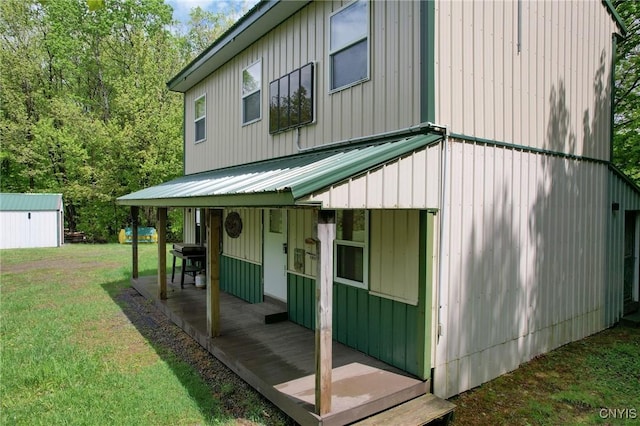 50 Apache Springs Rd, Boylston, NY 13083 - back of property featuring a lawn and board and batten siding