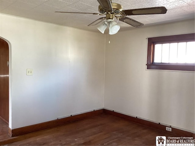51 Leming St, Dunkirk-City, NY 14048 - spare room featuring baseboards, a ceiling fan, arched walkways, and wood finished floors