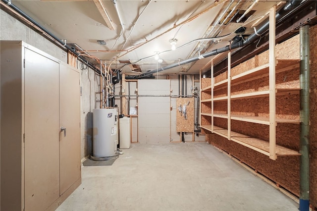 unfinished below grade area featuring water heater