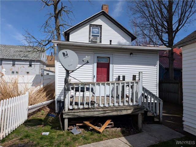 505 Canary St, Dunkirk-City, NY 14048 - view of front facade featuring fence, a deck, and a chimney