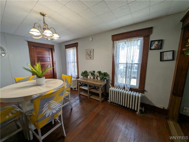 505 Canary St, Dunkirk-City, NY 14048 - dining area featuring hardwood / wood-style floors, radiator heating unit, a notable chandelier, and baseboards