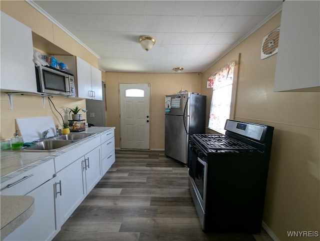505 Canary St, Dunkirk-City, NY 14048 - kitchen with ornamental molding, white cabinetry, dark wood-type flooring, appliances with stainless steel finishes, and a sink