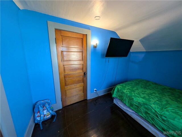 505 Canary St, Dunkirk-City, NY 14048 - bedroom with hardwood / wood-style floors, baseboards, and vaulted ceiling
