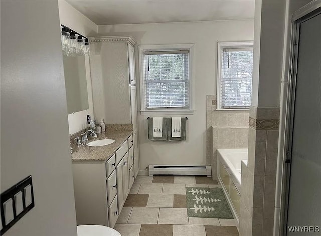 full bathroom with baseboard heating, a garden tub, and vanity