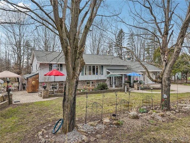 1465 Genesee St, Pembroke, NY 14036 - tri-level home featuring roof with shingles and a front yard