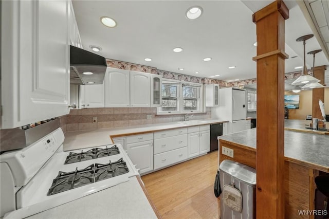 1465 Genesee St, Pembroke, NY 14036 - kitchen with glass insert cabinets, white appliances, a sink, extractor fan, and white cabinets