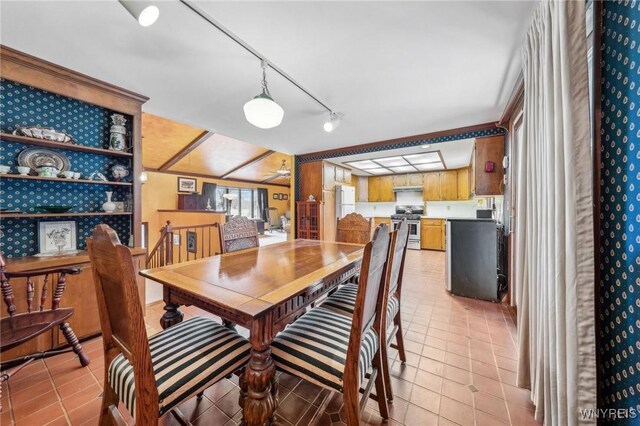 1465 Genesee St, Pembroke, NY 14036 - dining room featuring light tile patterned flooring, a ceiling fan, and track lighting