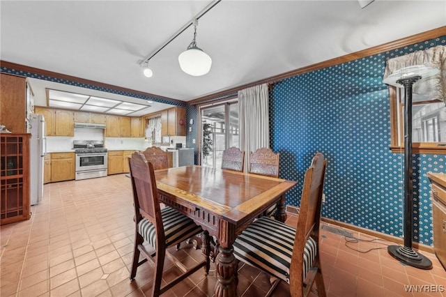 1465 Genesee St, Pembroke, NY 14036 - dining area featuring light tile patterned floors, rail lighting, and wallpapered walls