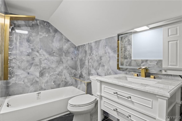 full bath with vanity, tile walls, vaulted ceiling, and toilet