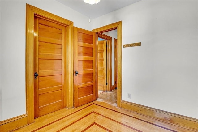 spare room featuring baseboards