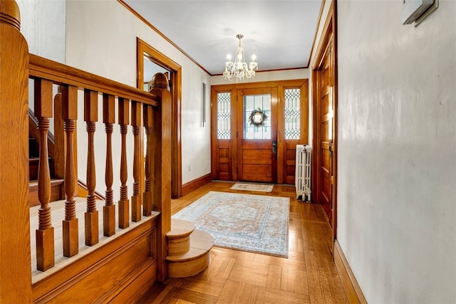 foyer with baseboards, a notable chandelier, crown molding, radiator, and wood finished floors