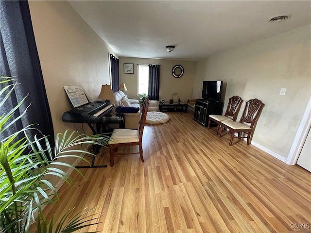 422 N James St, Rome-Inside, NY 13440 - sitting room with light wood-style flooring, baseboards, and visible vents