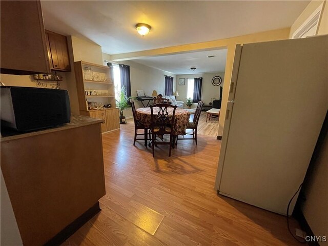422 N James St, Rome-Inside, NY 13440 - dining area with light wood-style floors