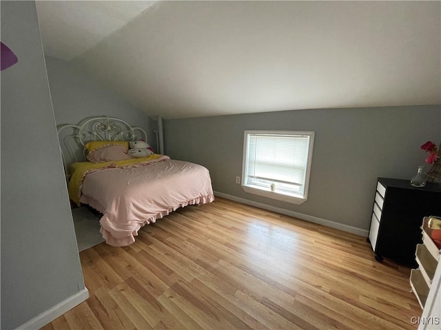 422 N James St, Rome-Inside, NY 13440 - bedroom featuring light wood finished floors, baseboards, and vaulted ceiling